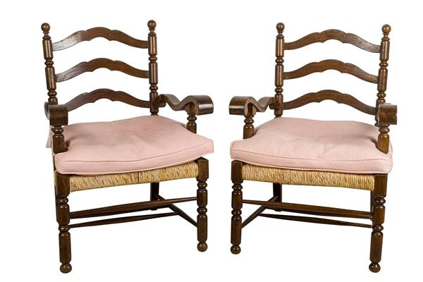 Pair of armchairs in walnut stained wood