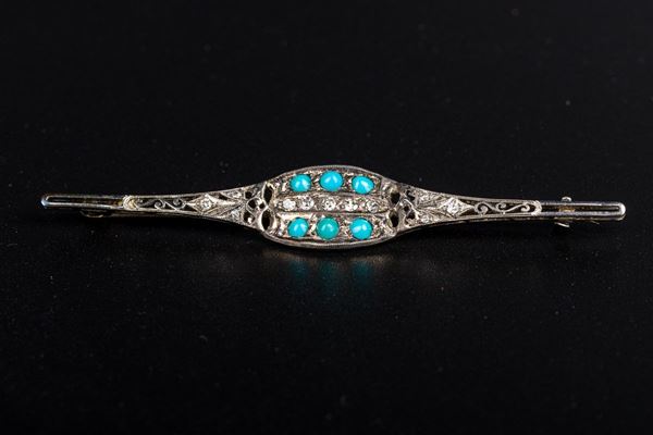 Spilla in oro bianco 18kt e oro giallo