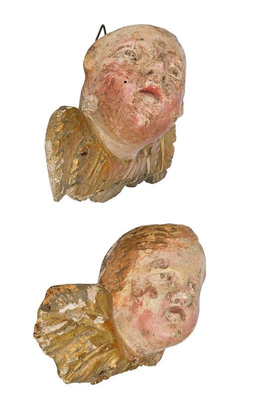 Pair of putto faces