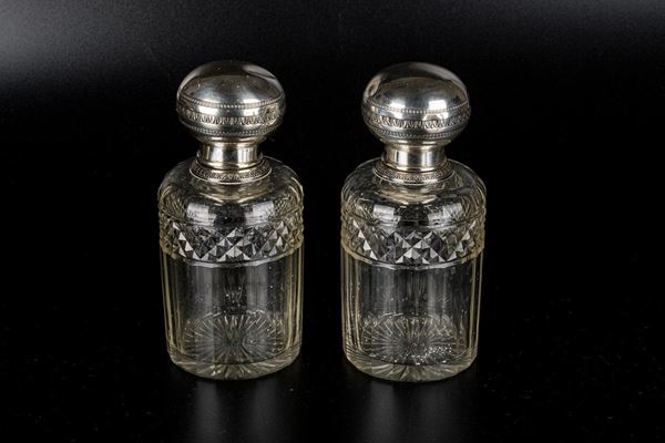 Pair of perfume bottles in 950 silver and counter-cut crystal