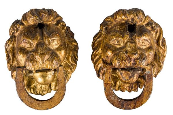 Pair of door knockers in gilded wood