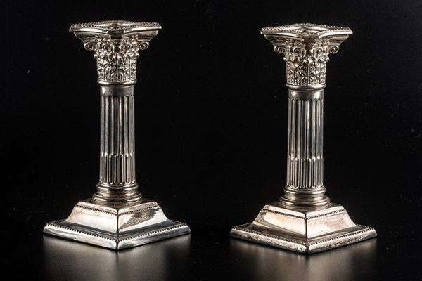 Pair of silver metal candle holders