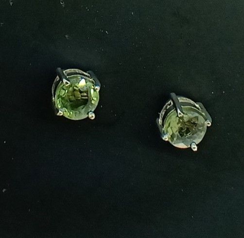 Pair of rhodium silver earrings with sapphires