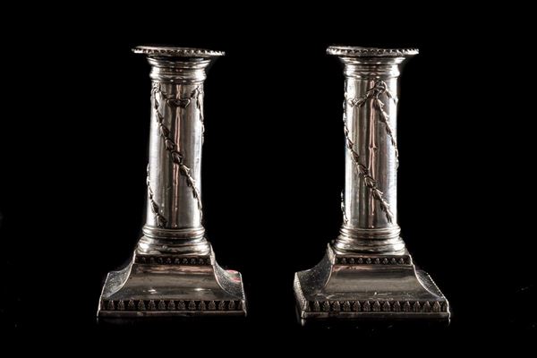 Pair of silver-plated metal candlesticks