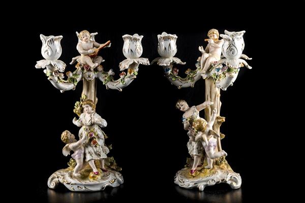 Pair of polychrome porcelain candelabra