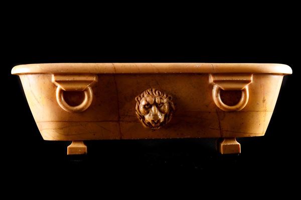 Antique yellow marble basin