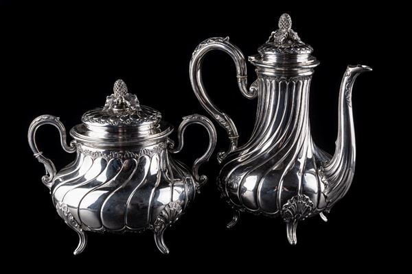 Silver teapot and sugar bowl