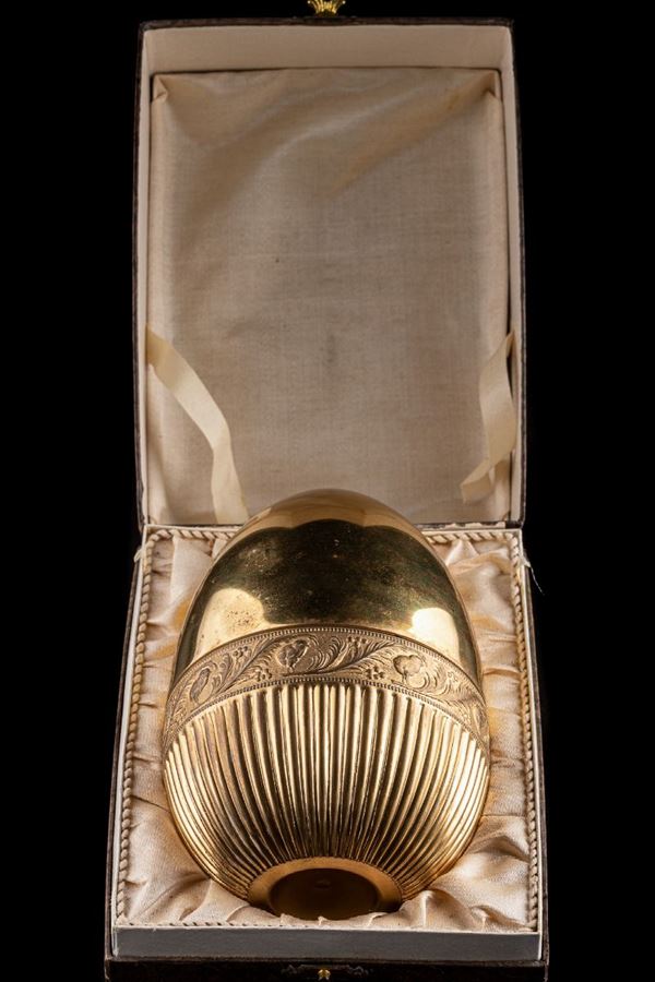 Egg in golden metal