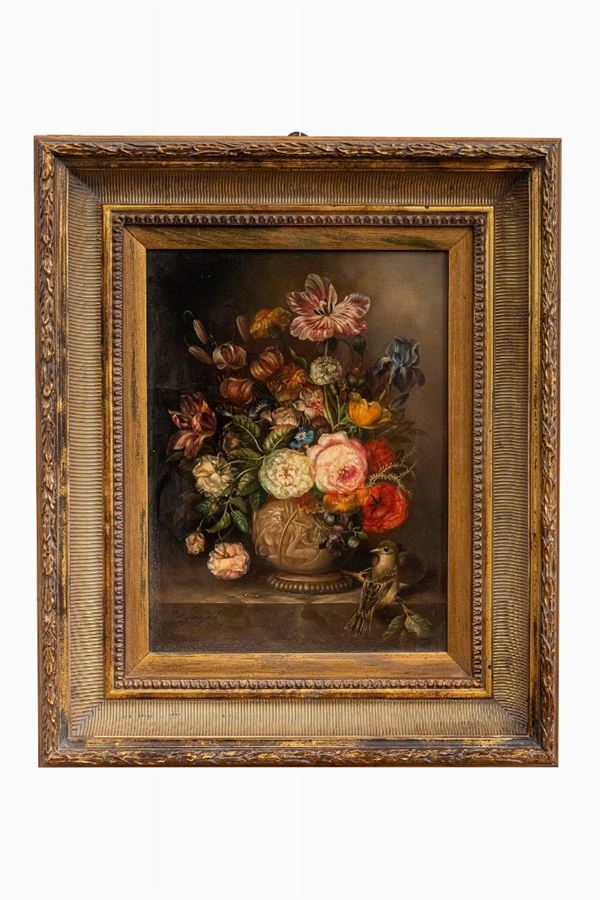 Bouquet of flowers in the vase with little bird