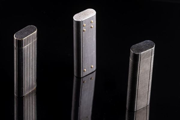 3 lighters with Cartier lettering
