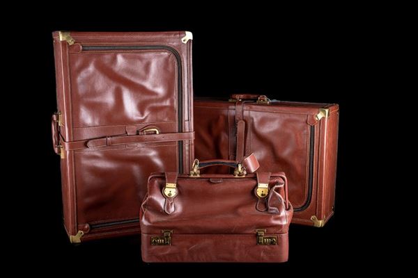 Lot of three leather suitcases