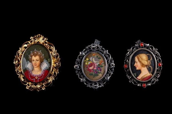 Lotto di tre spille/ciondoli in argento 800