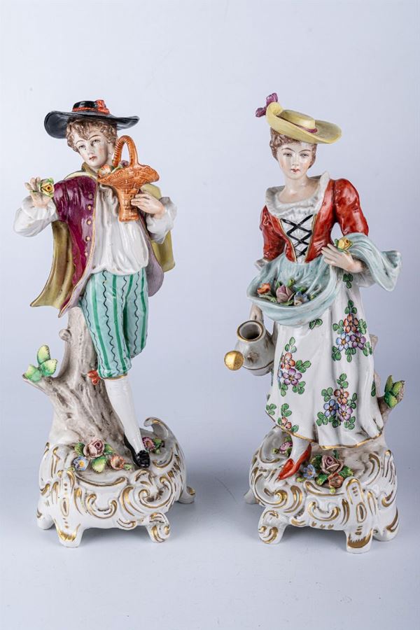 Couple of young people carrying flowers