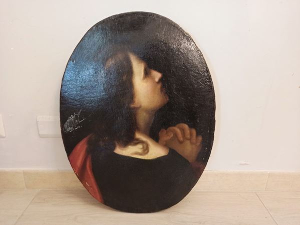 San Giovanni in preghiera ai piedi della croce