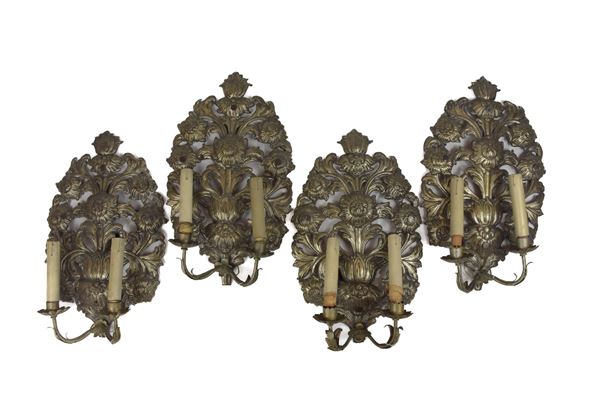 Quattro appliques in metallo argentato