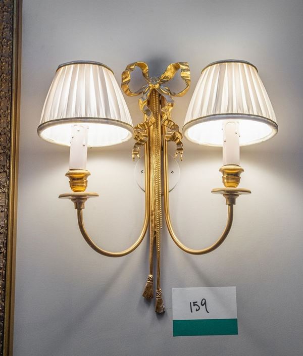 Quattro appliques a due luci