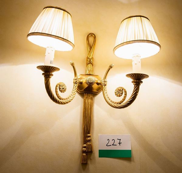 Quattro appliques a due luci