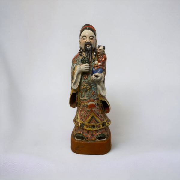 Figura di divinità orientale con bambino