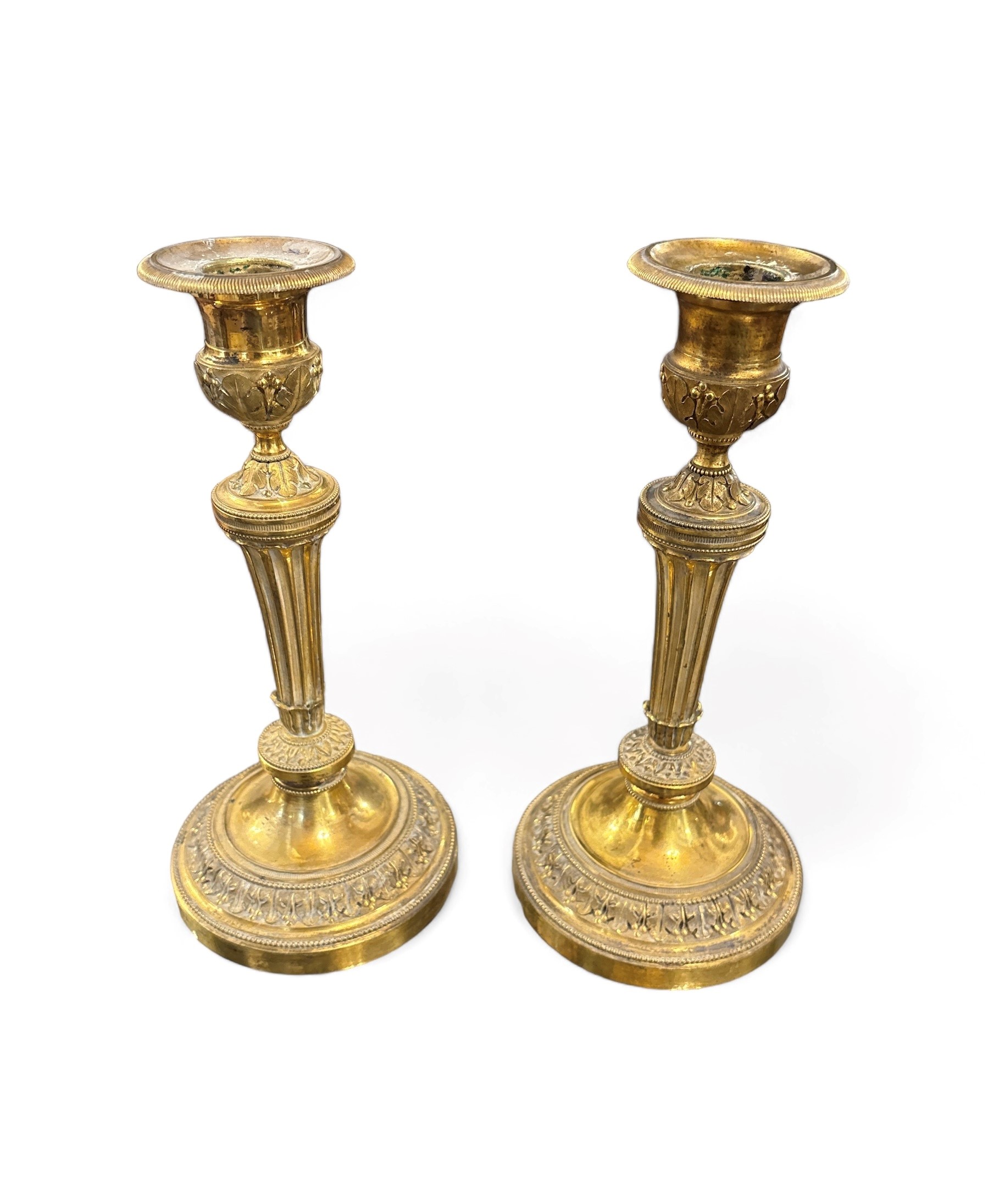 Due Coppie di candelieri in bronzo dorato