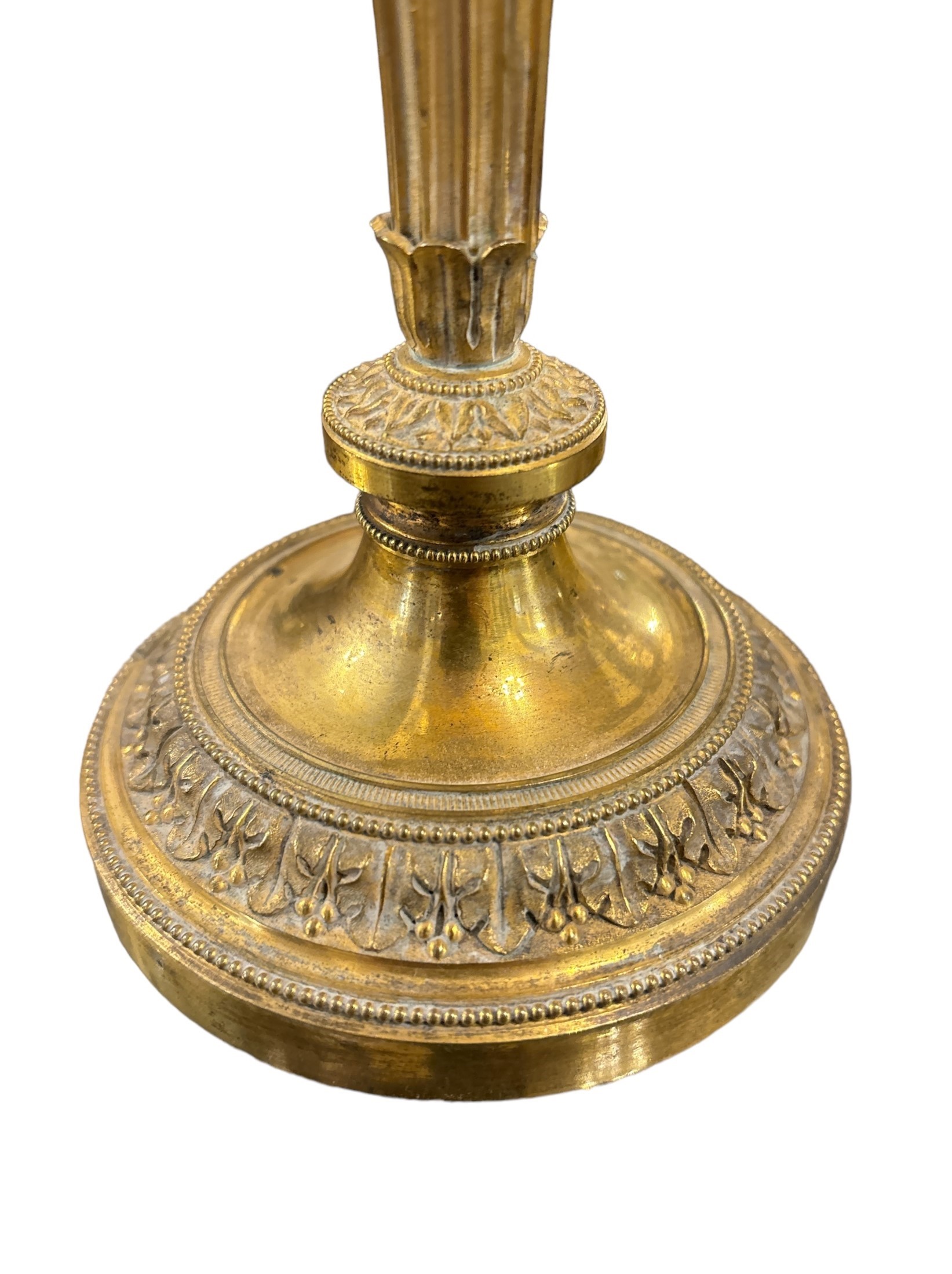 Due Coppie di candelieri in bronzo dorato