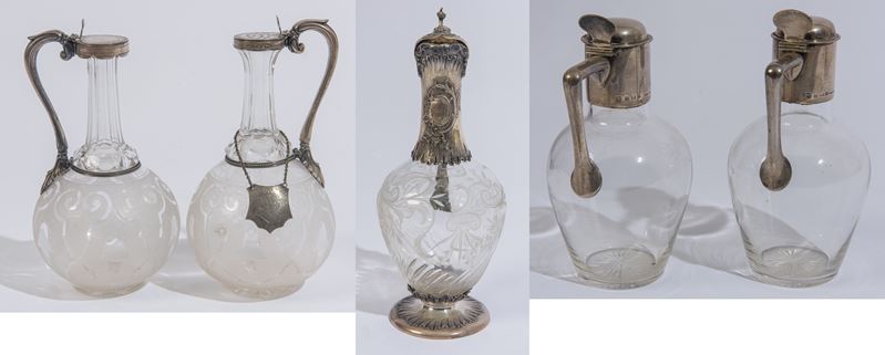 Cinque bottiglie in vetro e argento