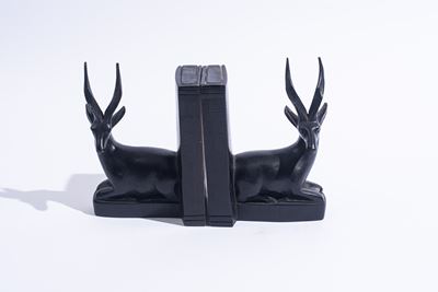 Coppia di fermalibri in legno scolpito, XX secolo