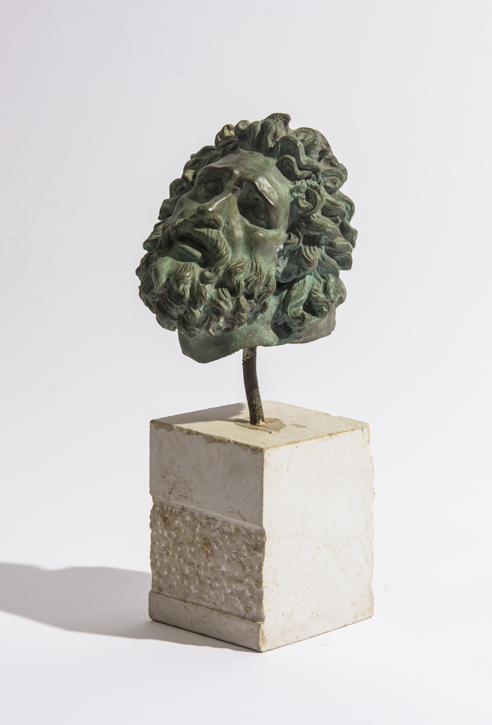 Scultura mitologica, bronzo a patina verde su basamento in pietra