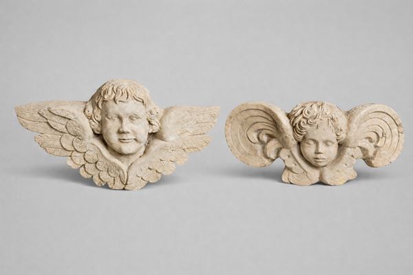 Coppia di sculture raffiguranti cherubini alati