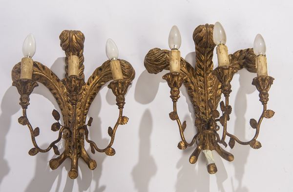 Coppia di appliques a tre luci