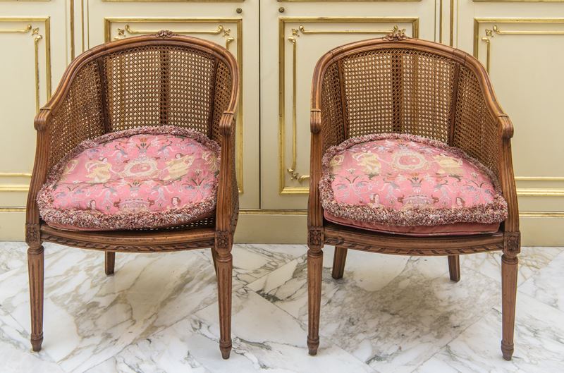 Coppia di poltroncine a pozzetto