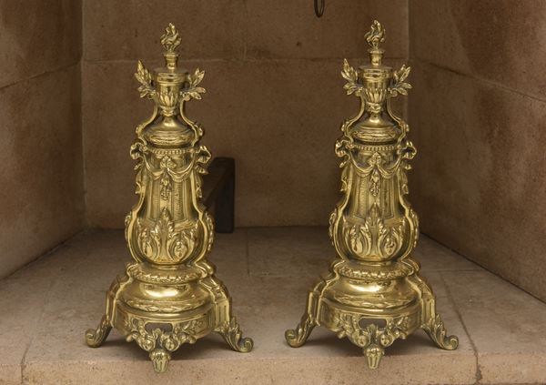 Coppia di alari in bronzo dorato