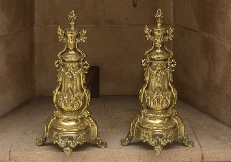 Coppia di alari in bronzo dorato