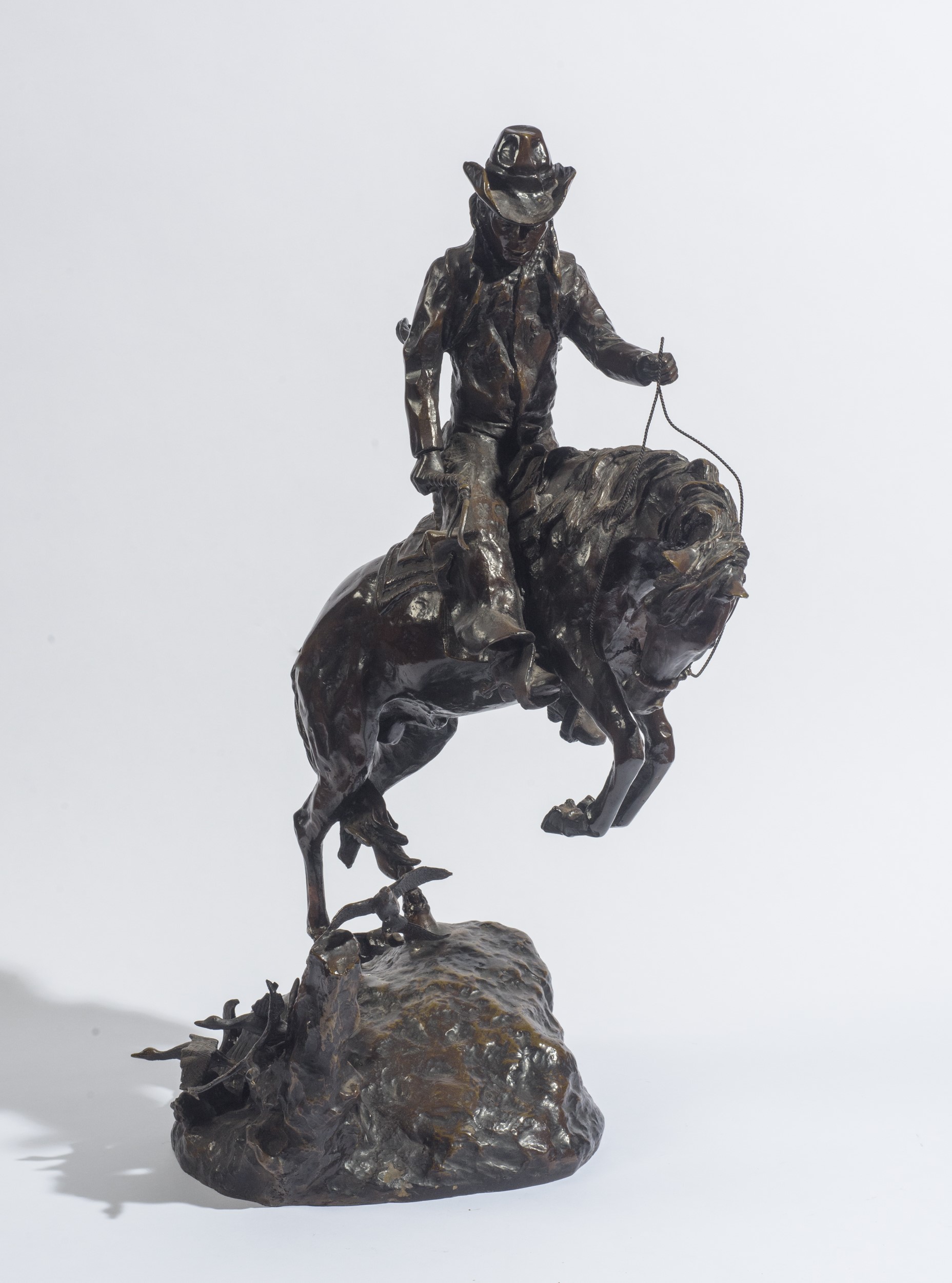 Frederic Remington - Cowboy, bronzo a patina bruna