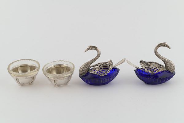 Lot of four silver and crystal salt shakers