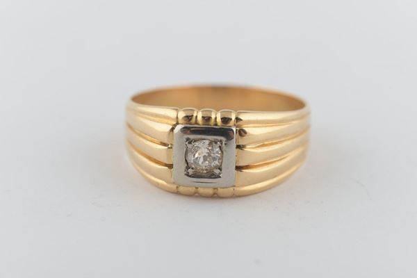 Anello in oro giallo e bianco con diamante